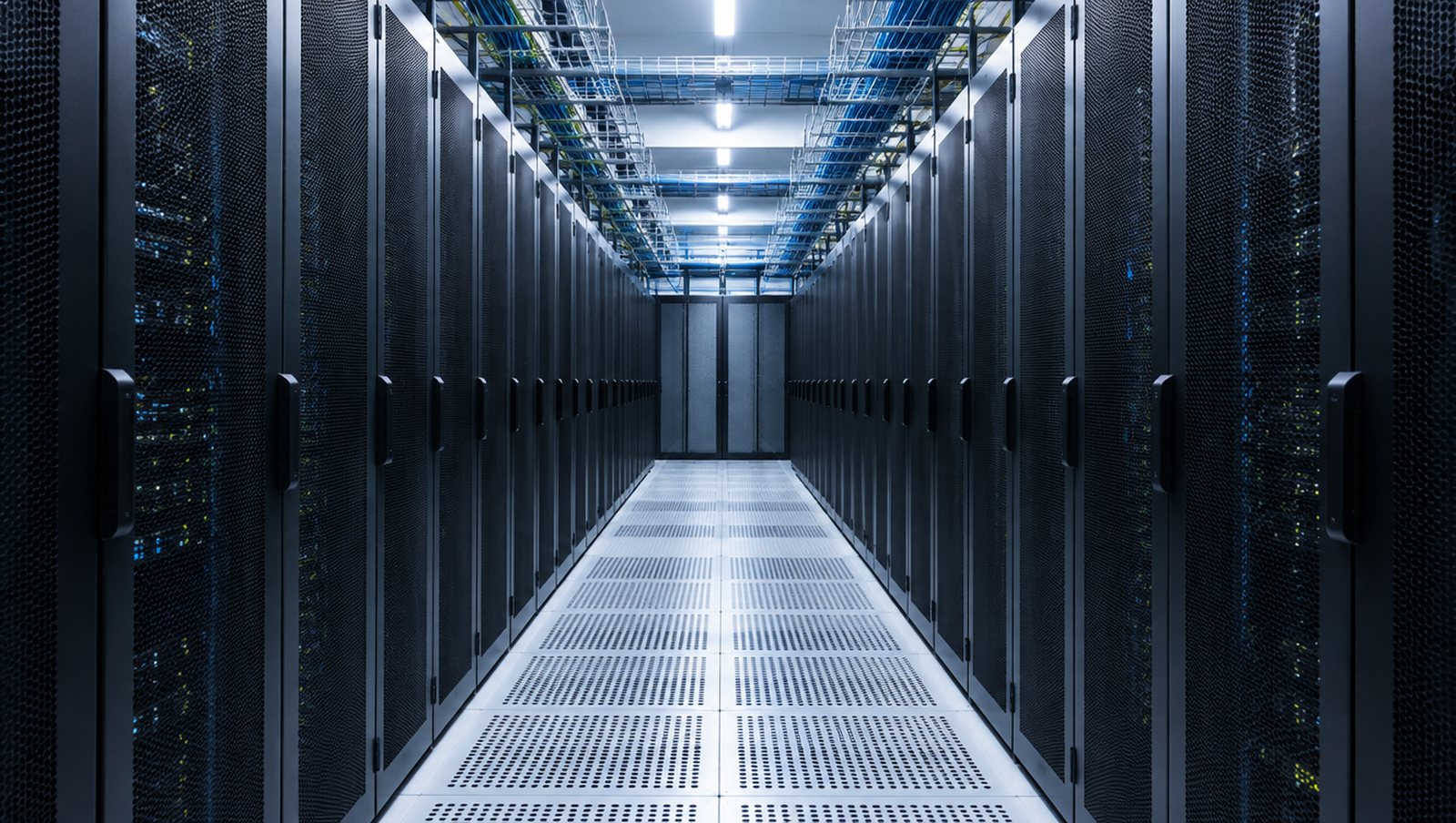 A cold aisle between two rows of closed server cabinets